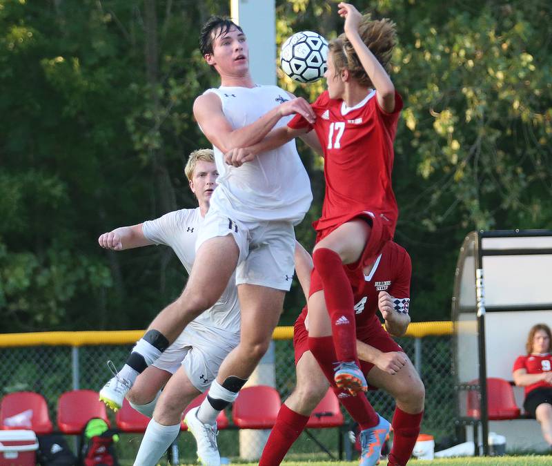 Bloomington Central Catholic's Brad Torry and Streator's Dalton Sliker jump in the air for a header on Wednesday, Aug. 23, 2023 at St. James Street Recreation Area in Streator.