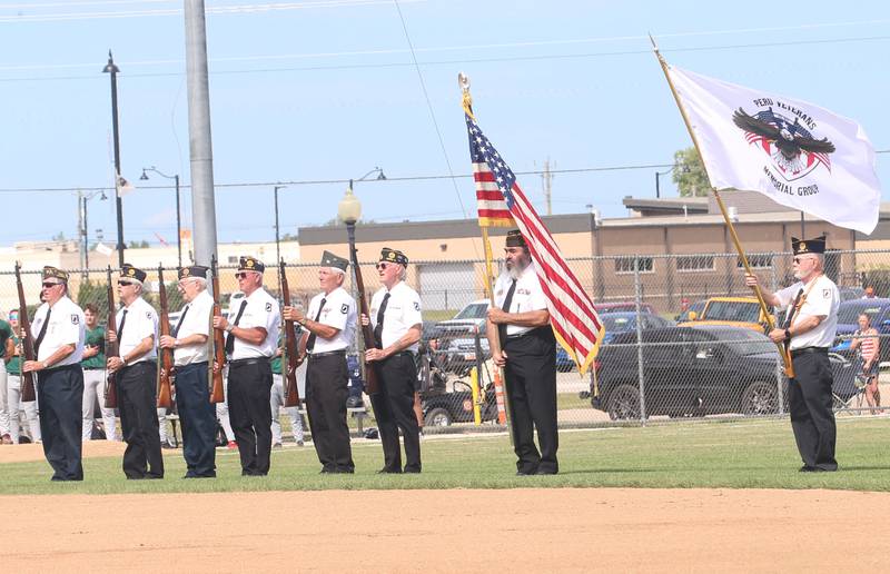 The Peru Veterans Memorial Group perform a gun salute on Wednesday, July 3, 2024 in Schweickert Stadium at Veterans Park in Peru.  The Pistol Shrimp held their annual Salute to Veterans honoring local members who served in the military.
