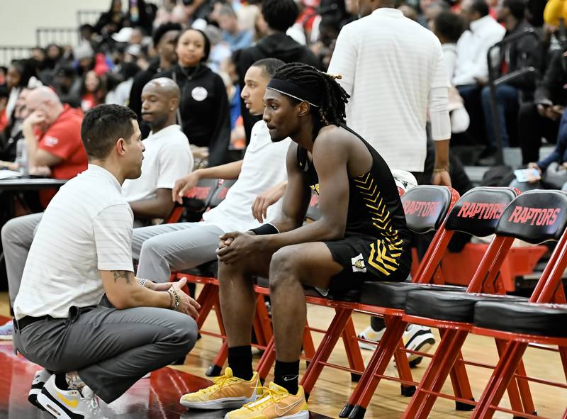 Joliet West's head coach Jeremy Kreiger talks with Justus Mcnair  during the Class 4A sectional semifinal against Homewood Flossmoor at Rich Township on Tuesday, Feb. 27, 2024, at Richton Park. (Dean Reid for Shaw Local News Network)