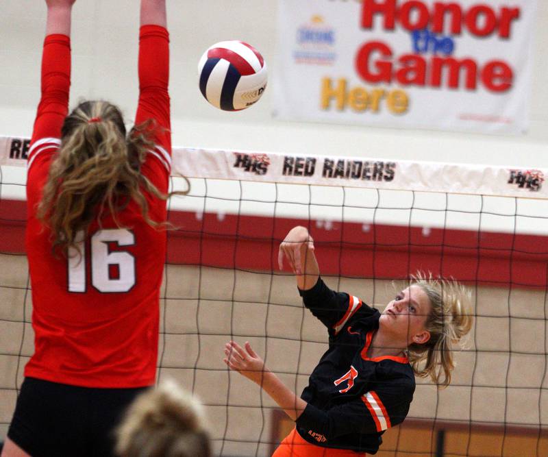 Crystal Lake Central’s Alexis Hadeler, right, sends the ball over the net during a Fox Valley Conference volleyball match on Tuesday, Aug. 27, 2024, at Huntley High School.