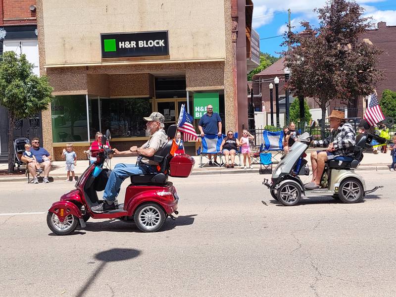 A couple of creative entries scoot their way through the Liberty Fest parade on Sunday, June 30, 2024, in Streator.