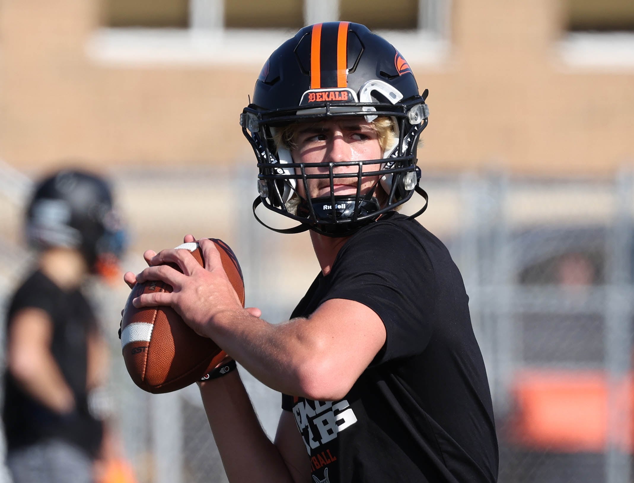 Dekalb quarterback Cole Latimer looks for a receiver Monday, Aug. 12, 2024, at the school during the first practice of the regular season.