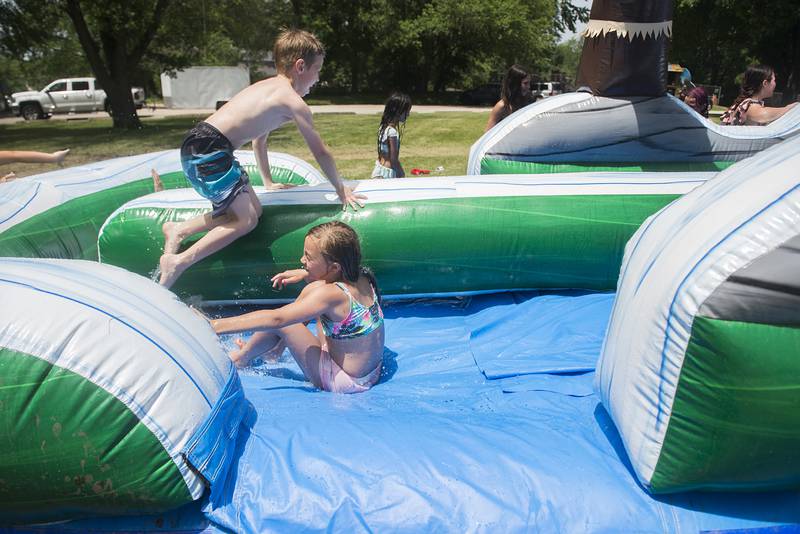 Kids play on one of the water slides Wednesday at the Dixon Park District SPARK camp. Campers could play volleyball, dodgeball, or enjoy a variety of water-based activities — which were popular as temps soared into the mid-90s.