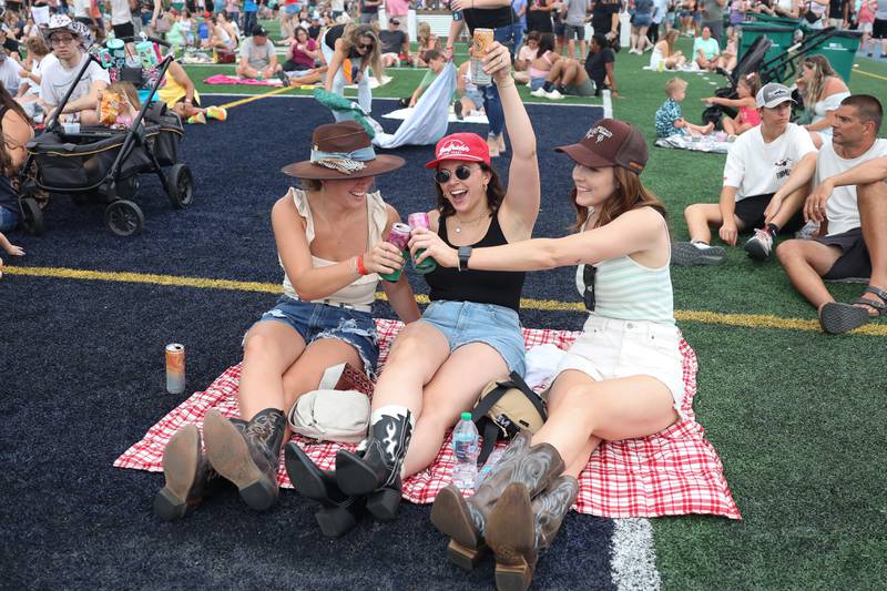 Laura Katarzynske, left Ronni Olczyk and Mary Kate enjoy the music of Reckless Road at the Taste of Joliet on Saturday, June 22, 2024 at Joliet Memorial Stadium.