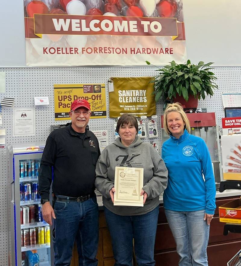 Gary and Jane Koeller pose with Rep. Tony McCombie (right) in their store, Koeller Hardware, located in downtown Forreston.