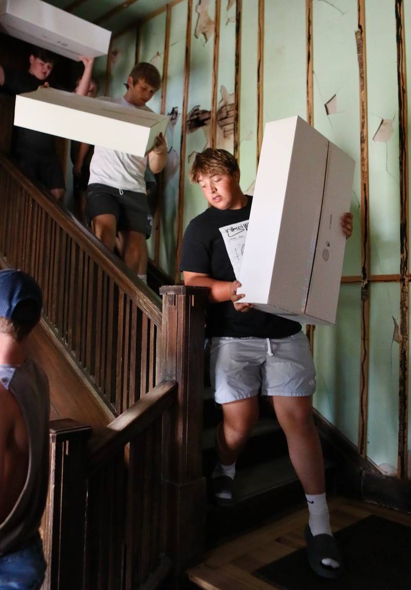 PHS senior Anthony Vujanov helped move boxes from the third floor of the Sash Stalter Matson Building to the basement in a matter of 15 minutes for the Bureau County Historical Society.