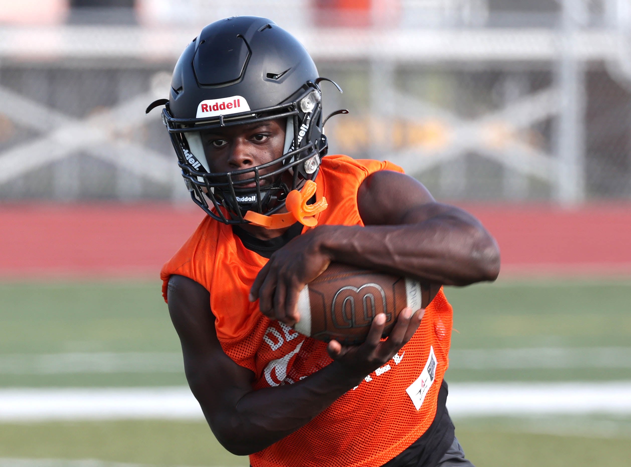 Dekalb’s Mariyan Dudley carries the ball Monday, Aug. 12, 2024, at the school during the first practice of the regular season.