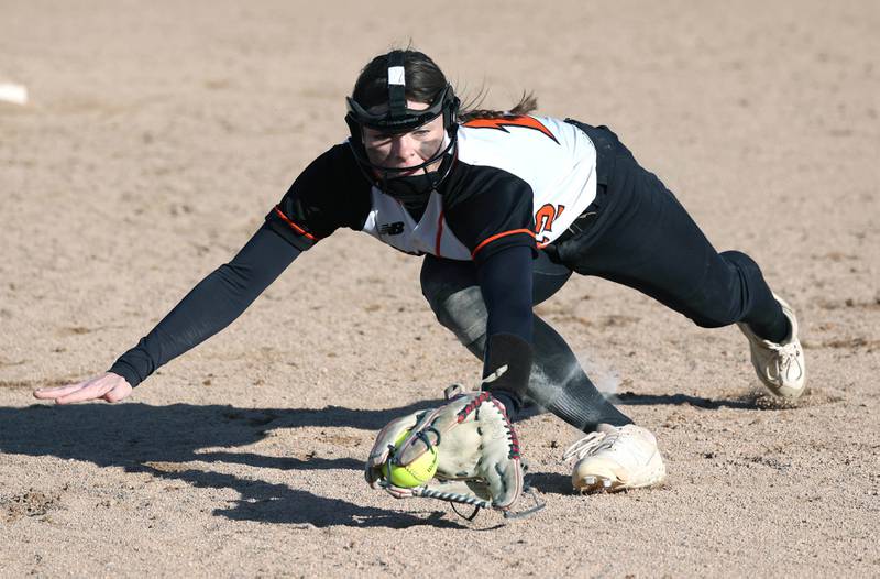 Sandwich's Brooklyn Marks makes a diving play at shortstop during their game against DeKalb Tuesday, March 19, 2024, at DeKalb High School.