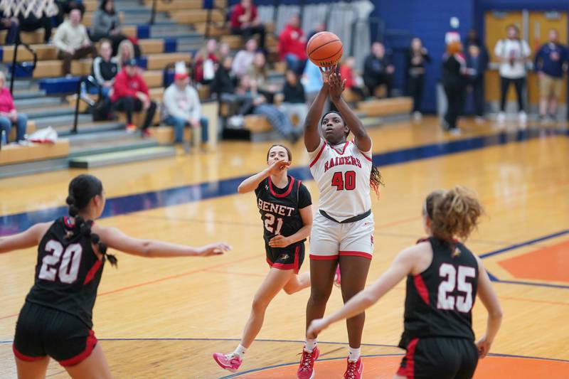 Bolingbrook's Jasmine Jones (40) shoots the ball in the paint against Benet’s Ava Mersinger (21) during a Oswego semifinal sectional 4A basketball game at Oswego High School on Tuesday, Feb 20, 2024.