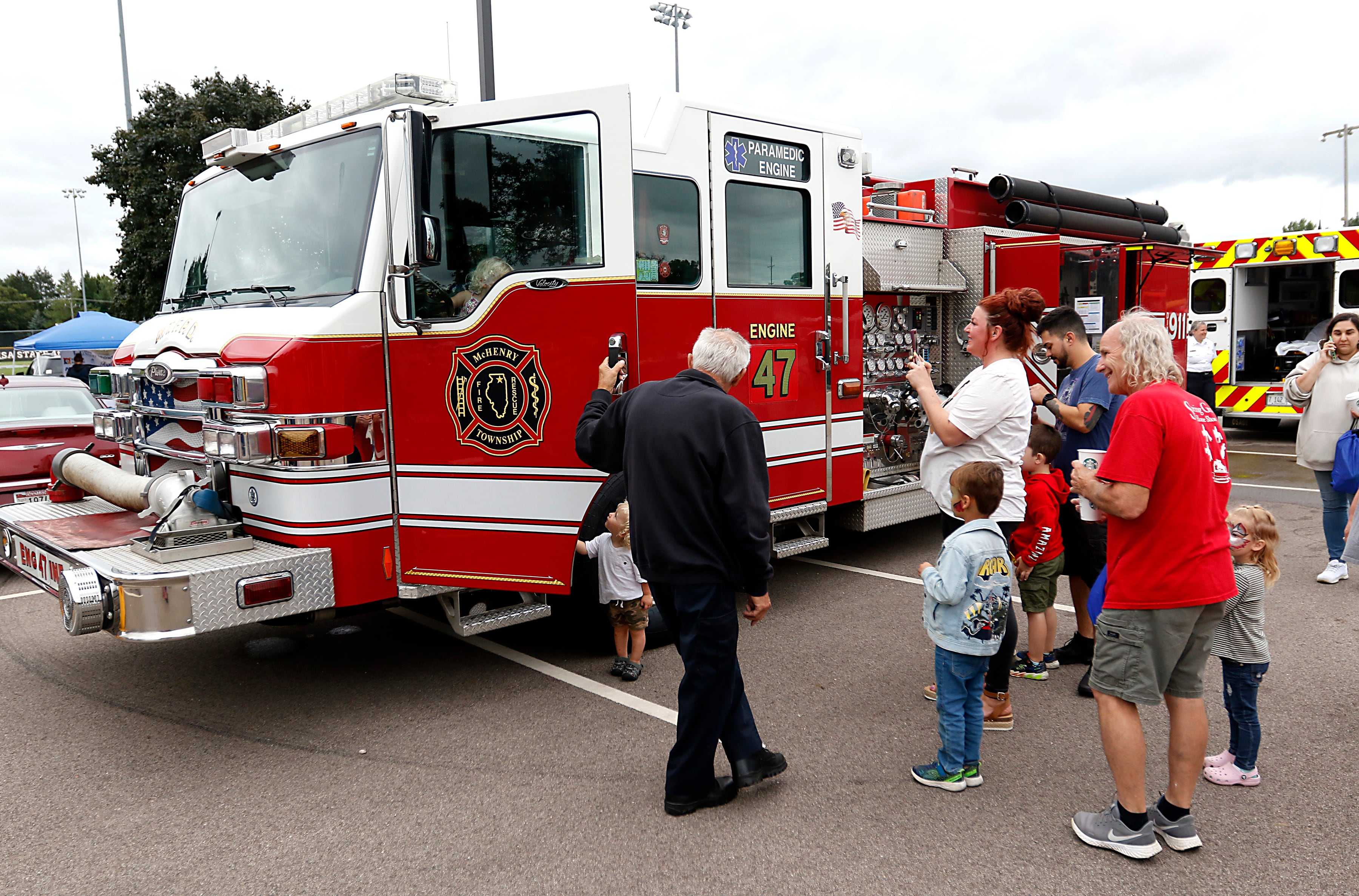 People check out a McHenry Township fire engine during a National Night Out event Tuesday, Aug. 6, 2024, at Petersen Park in McHenry hosted by McHenry, the sheriff's office, Johnsburg and McHenry Township Fire Protection District.