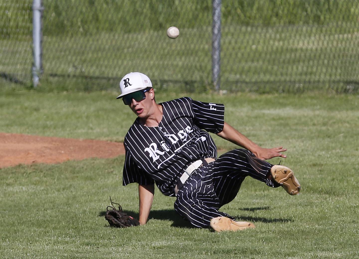 The ball bounces after Prairie Ridge's Karson Stiefer attempted to catch a foul ball during a Class 3A Deerfield baseball regional game against Deerfield on Wednesday, May 22, 2024, at the Deerfield High School.
