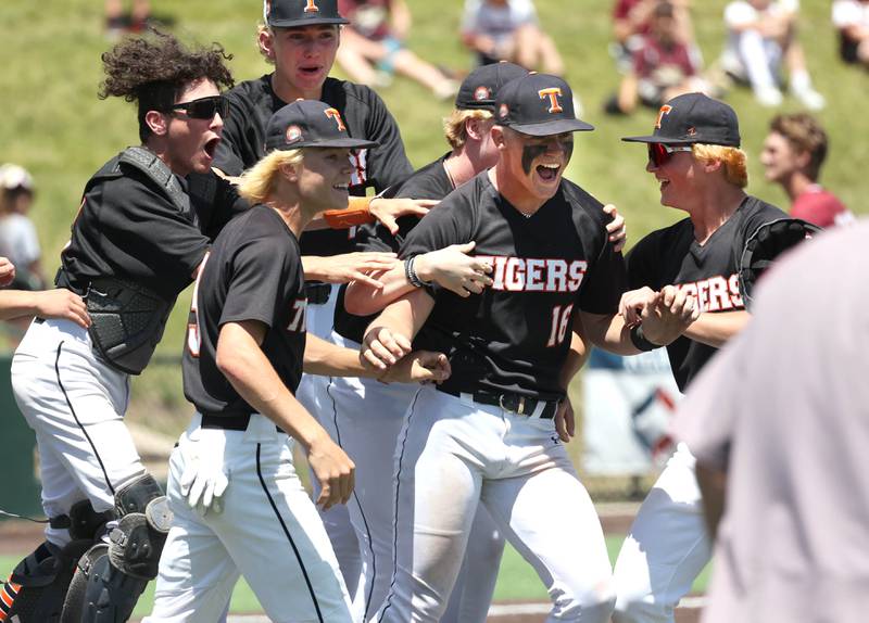 Crystal Lake Central players celebrate after the last out of their win over Morris in the Class 3A state semifinal game Friday, June 7, 2024, at Duly Health and Care Field in Joliet.