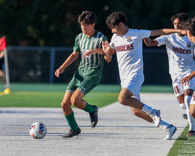 Plainfield Central's Sebastian Chavez (15) fights for possession during a soccer match between Bolingbrook and Plainfield Central on Tuesday, Sept. 3, 2024 in Plainfield.