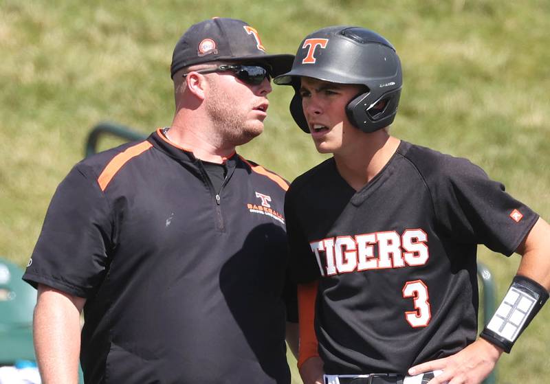 Crystal Lake Central head coach Cal Aldridge talks to Crystal Lake Central’s James Dreher during their Class 3A state semifinal game against Morris Friday, June 7, 2024, at Duly Health and Care Field in Joliet.