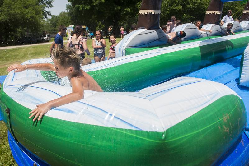 Paxton Fassler, 8, got a big head of steam at end of the waterslide Wednesday, June 15, 2022.