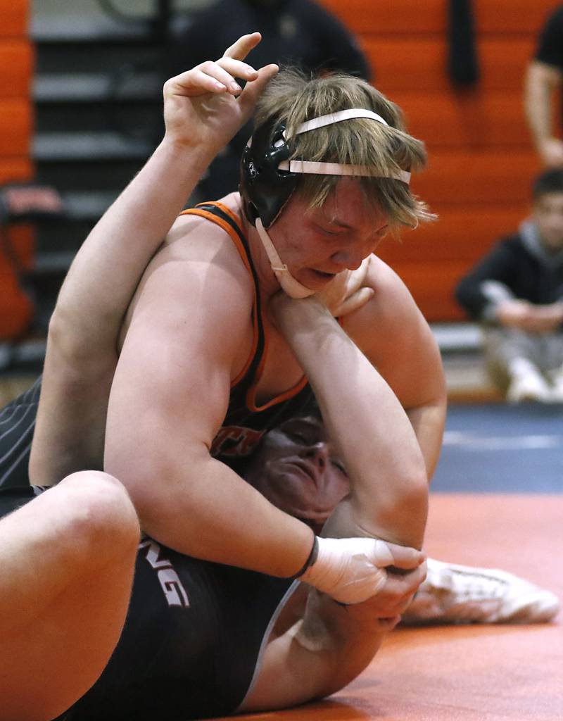 Crystal Lake Central Tommy McHeil tries to control Prairie Ridge\s John Fallaw during the 215-pound championship match of a the IHSA 2A Crystal Lake Central Wrestling Regional on Saturday, Feb. 3, 2024, at Crystal Lake Central High School.