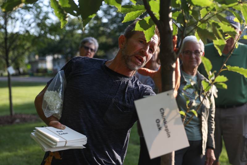 Arborist Jim Teiber talks about tree care to a group during an educational Tree Walk at the Arboretum at the Broadway Greenway in Joliet on Wednesday, Aug. 16, 2023.