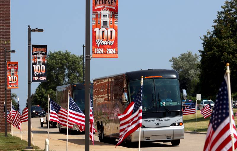 Coach buses carrying veterans approach as McHenry Community High School hosted a celebration Sunday for veterans returning from an Honor Flight trip to Washington D.C. The Honor Flight trip was coordinated by the Veterans Network Committee of Northern Illinois.