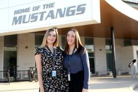 Coming home. Two District 99 faculty members return to teach at their alma mater  