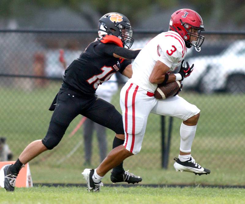 Huntley’s Jordan Oruche, right, hauls in a touchdown pass as Crystal Lake Central’s Ben Freese defends in varsity football on Friday, Aug. 30, 2024, at Metcalf Field on the campus of Crystal Lake Central High School in Crystal Lake.