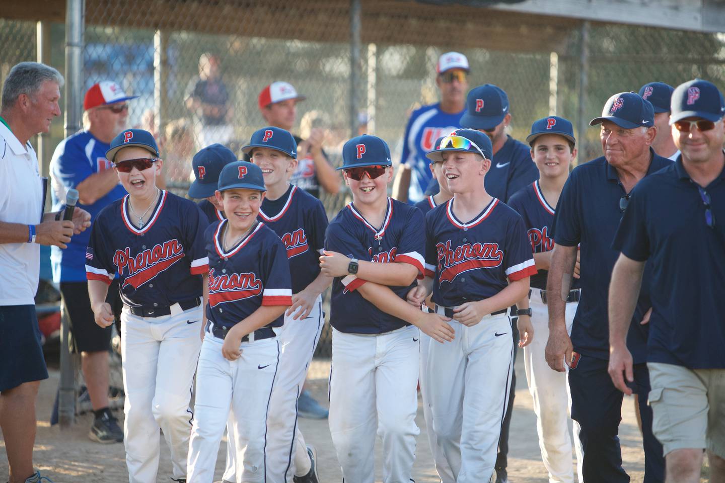 Teams participate in the Opening Ceremony Parade at the MCYSA 2022 Summer International Baseball Tournament hosted by McHenry County Youth Sports Association ate Lippold Park on July 21,2022 in Crystal Lake.