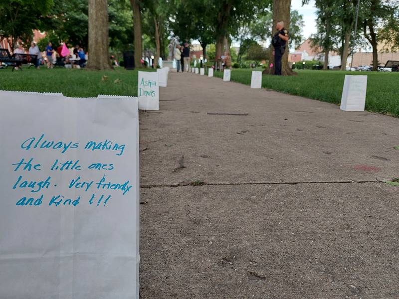 Messages are written on memorials in Washington Square in Ottawa to remember those who died in the LGBTQ community related to navigating life in a marginalized community.