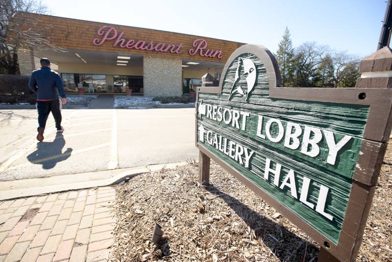 Ryan Oshlo of St. Charles heads back into Pheasant Run Resort after checking out on Saturday Feb. 29, 2020 after staying one last night with his family.