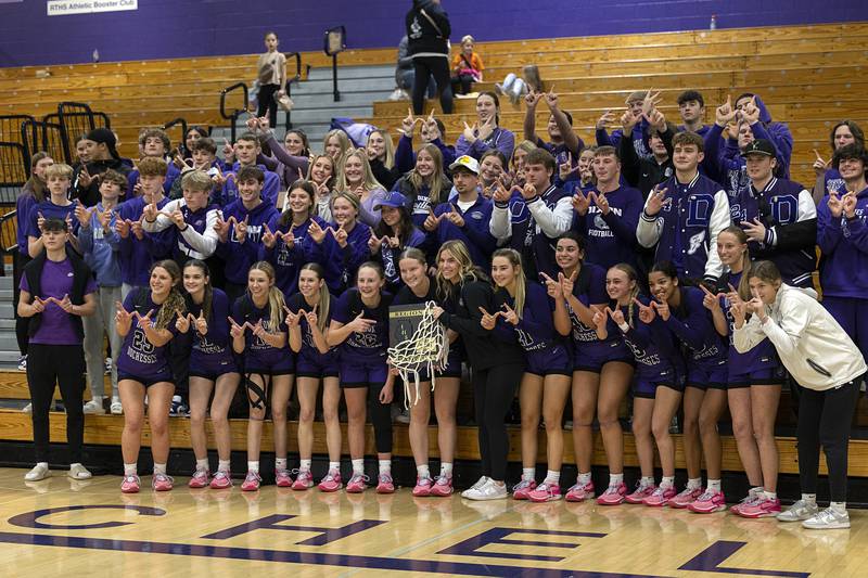 Dixon players and their classmates celebrate their title win over Boylan Friday, Feb. 16, 2024 at the class 3A Rochelle girls basketball regional.