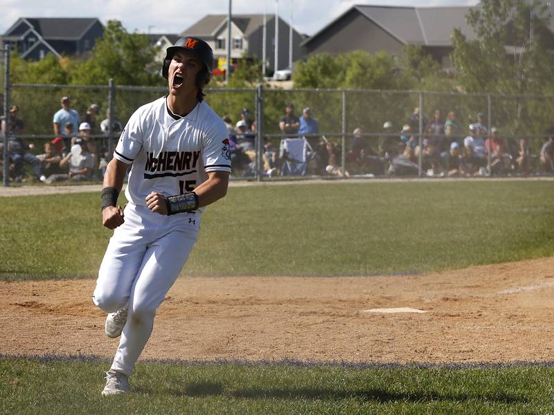 McHenry's Kyle Maness celebrates scoring the go ahead run on a passed ball during a Class 4A Hampshire sectional baseball game against Hampshire on Wednesday, May 29, 2024, at the Hampshire High School.