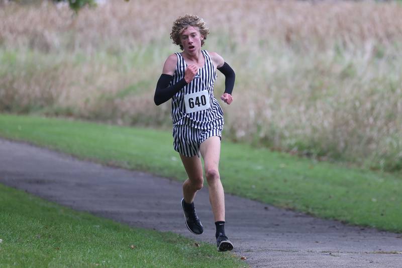 Plainfield South’s Dylan Maloney takes a commanding lead midway in the Southwest Prairie Conference meet at Channahon Park in Channahon on Friday, Oct. 13, 2023.