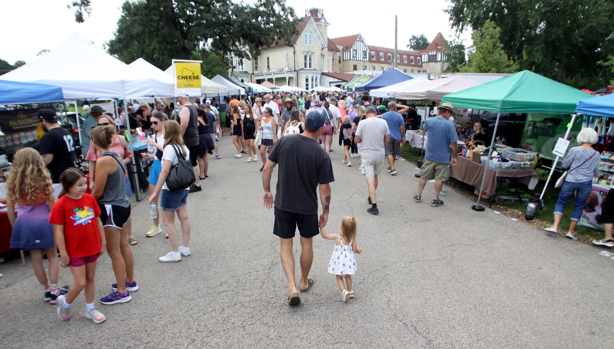 People enjoy The Dole Farmers Market in Crystal Lake Sunday.