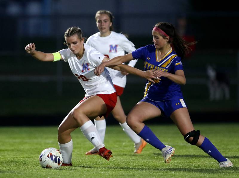 \mc20 battles with Johnsburg's London Baidinger for control of the ball during the IHSA Class 1A Marengo Regional championship soccer match on Tuesday, May 14, 2024, at Marengo High School.