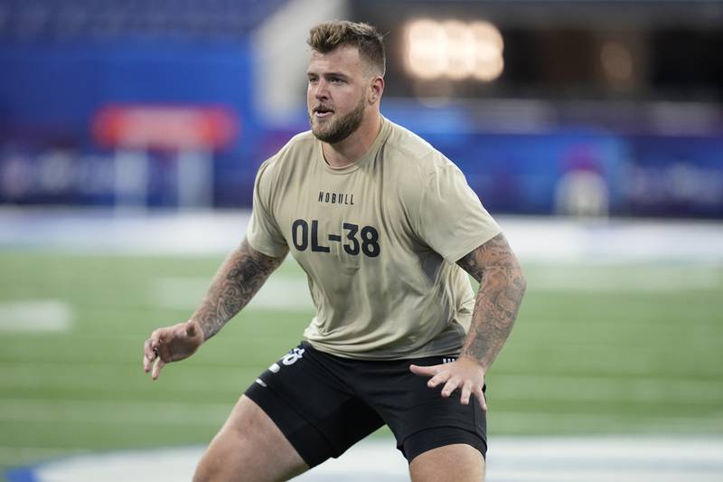 Michigan offensive lineman Trevor Keegan, a Crystal Lake South grad, runs a drill at the NFL combine in March 2024, in Indianapolis.