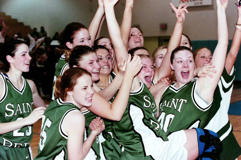 Members of the 2000 St. Bede Lady Bruins celebrate winning the Class 1A Sectional after defeating Rockridge on Feb. 14, 2000 at Bureau Valley High School.