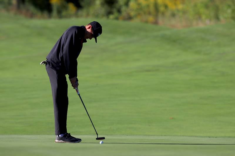 Huntley’s Austin Matich putts on the 5th green in Cary-Grove High School 2024 Invitational varsity golf action on Saturday, Sept. 7, 2024, at Foxford Hills Golf Club in Cary.