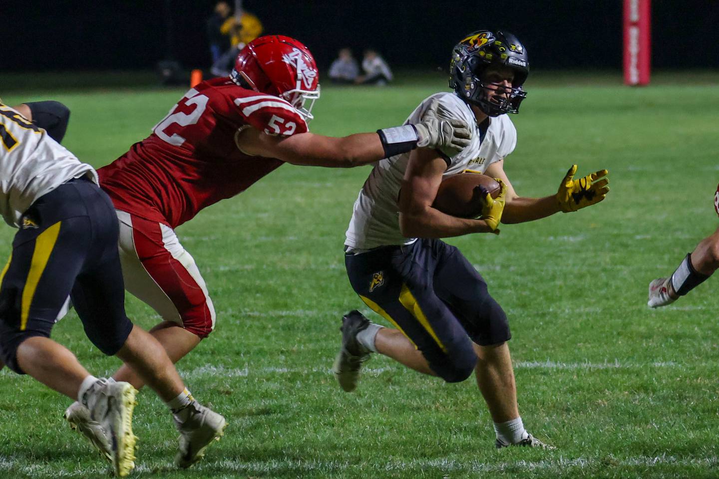 Kolton Kruse of Riverdale runs ball whilst Cameron Spalding of Hall attempts to tackle him on Friday, October 18, 2024 at Richard Nesti Stadium in Spring Valley.