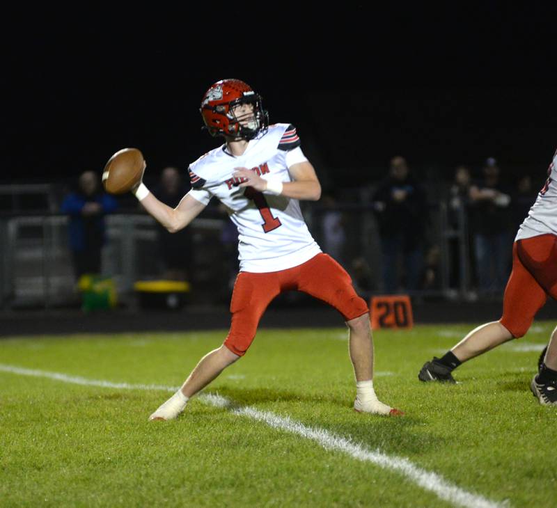 Fulton's Braedon Meyers (1) winds up to complete a touchdown pass to Jacob Huisenga against Durand-Pecatonica on Friday, Oct. 11, 2024 at Pecatonica.