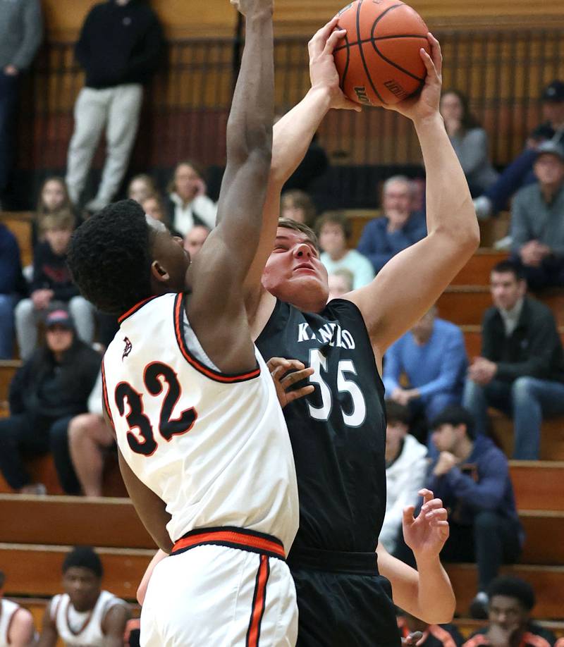 Kaneland's Jake Buckley goes up for a shot against DeKalb’s Justin O’Neal during their game Monday, Feb. 12, 2024, at Huntley Middle School in DeKalb.