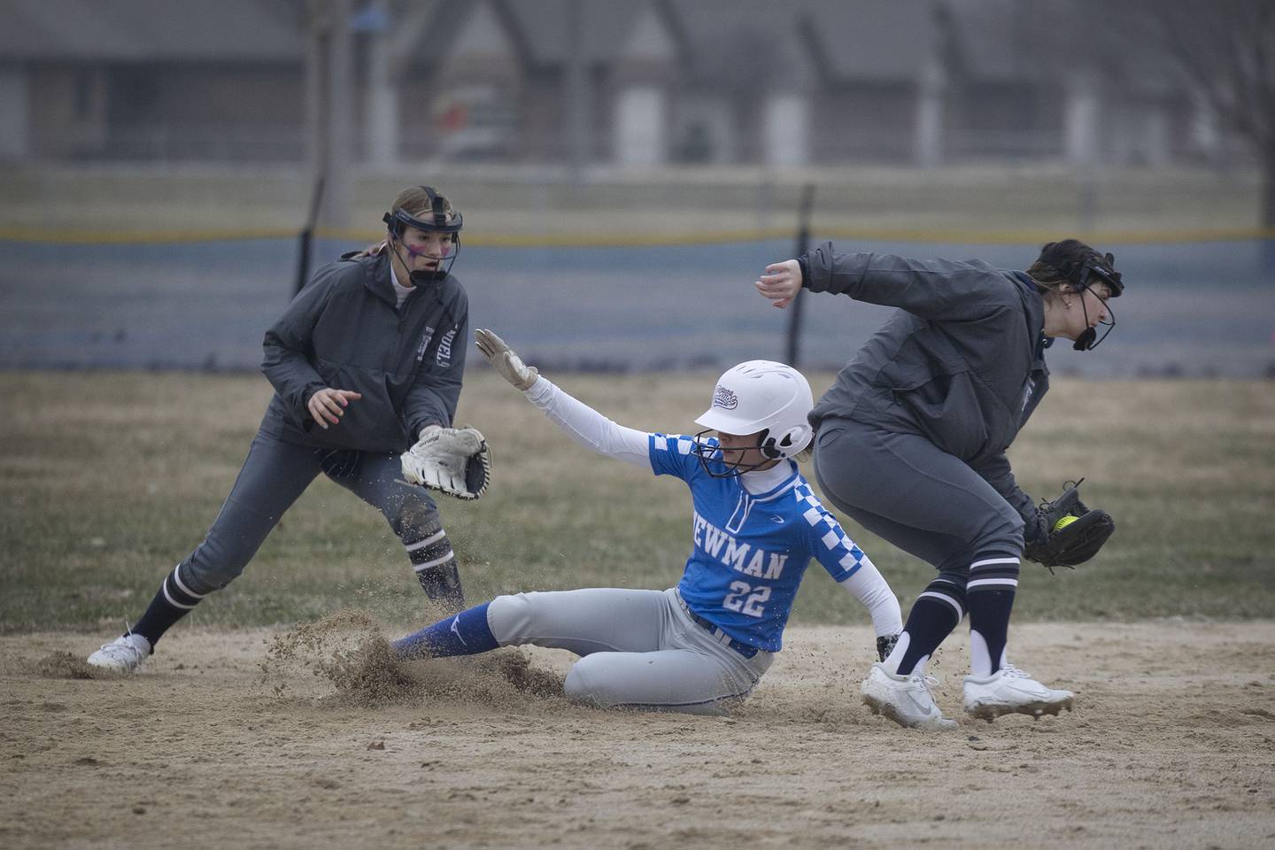 Newman’s Madison Duhon slides in safely at second for a steal against Annawan-Wethersfield Wednesday, March 22, 2023.