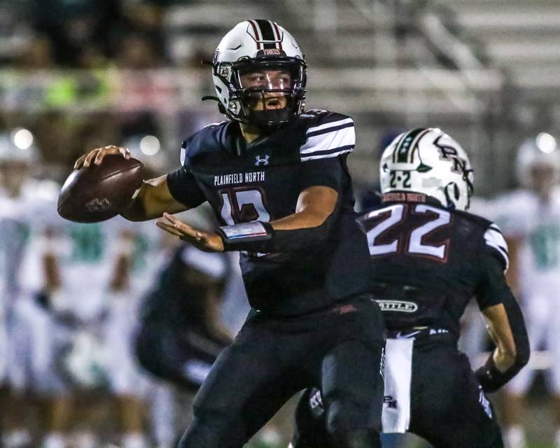 Plainfield North's Justus Byrd (13) drops back to pass during a football game between York at Plainfield North on Friday, Sept 6th, 2024 in Plainfield. Gary E Duncan Sr for Shaw Local News Network.