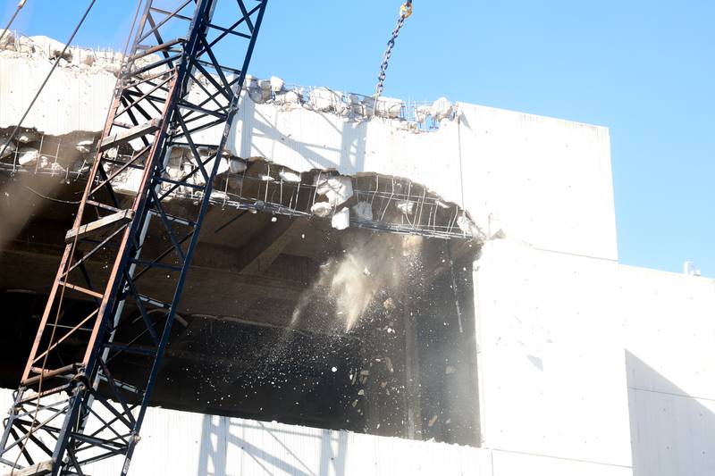 A wreaking ball breaks through the roof of the old Will County Courthouse during on the external demolition on Friday, Feb. 9th 2024 in Joliet.