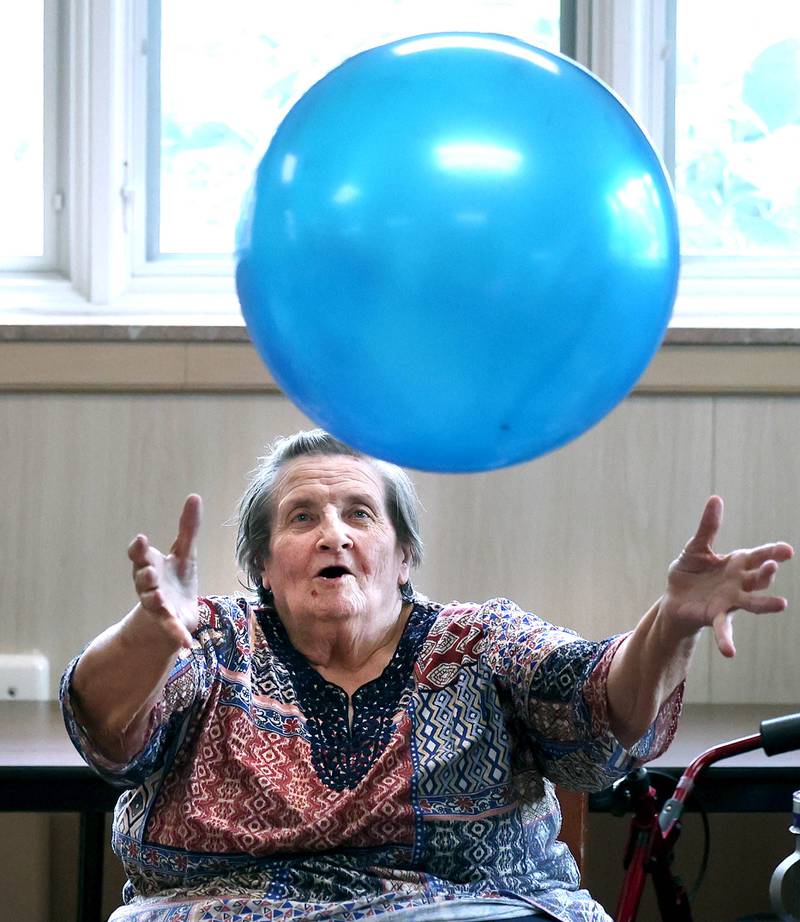 Barb City Manor resident Jean Wiser makes a catch during an activity Tuesday, July 2, 2024, at the retirement home in DeKalb. Barb City Manor celebrated its 45th anniversary earlier this year.