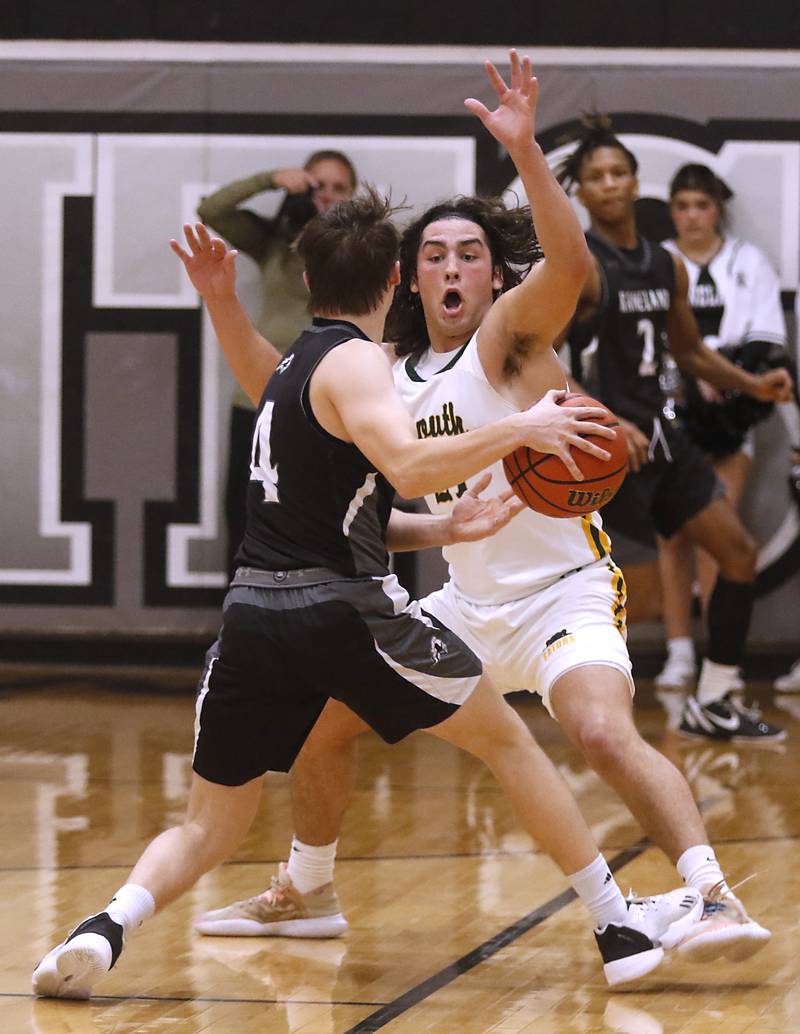 Crystal Lake South's Michael Prokos guards Kaneland's Preston Popovich during the IHSA Class 3A Kaneland Boys Basketball Sectional championship game on Friday, March 1, 2024, at Kaneland High School in Maple Park.