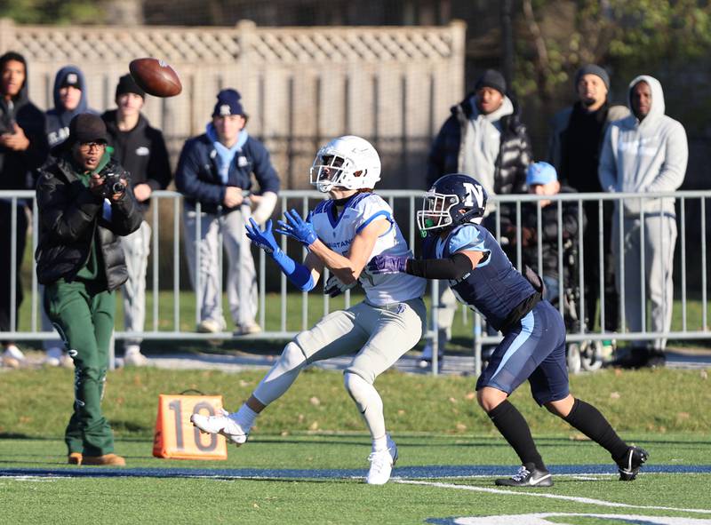 St. Francis' Zachary Washington (4) makes a reception against Nazareth during the boys varsity IHSA 5A semifinal between Nazareth Academy and St. Francis high school in La Grange Park, IL on Saturday, Nov. 18, 2023.