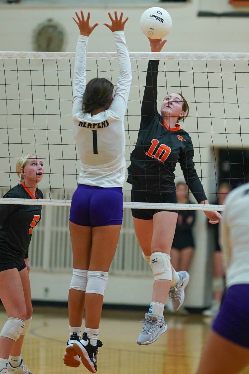 Sandwich’s Kayden Corneils (10) goes up for a kill attempt against Plano’s Hennessy Pena (1) during a volleyball match at Sandwich High School on Tuesday, Sep 10, 2024.