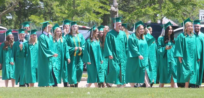 Graduates walk in procession to the Abbey Church for the commencement ceremony on Sunday, May 19, 2024 at St. Bede Academy.