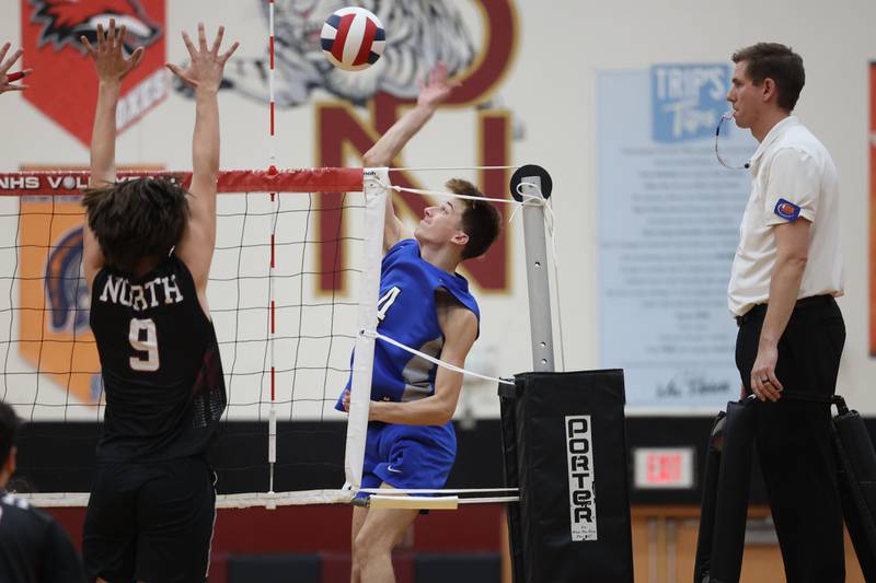 Lincoln-Way East’s Joey Abbeduto goes up for the kill against Plainfield North on Tuesday, April 2, 2024.
