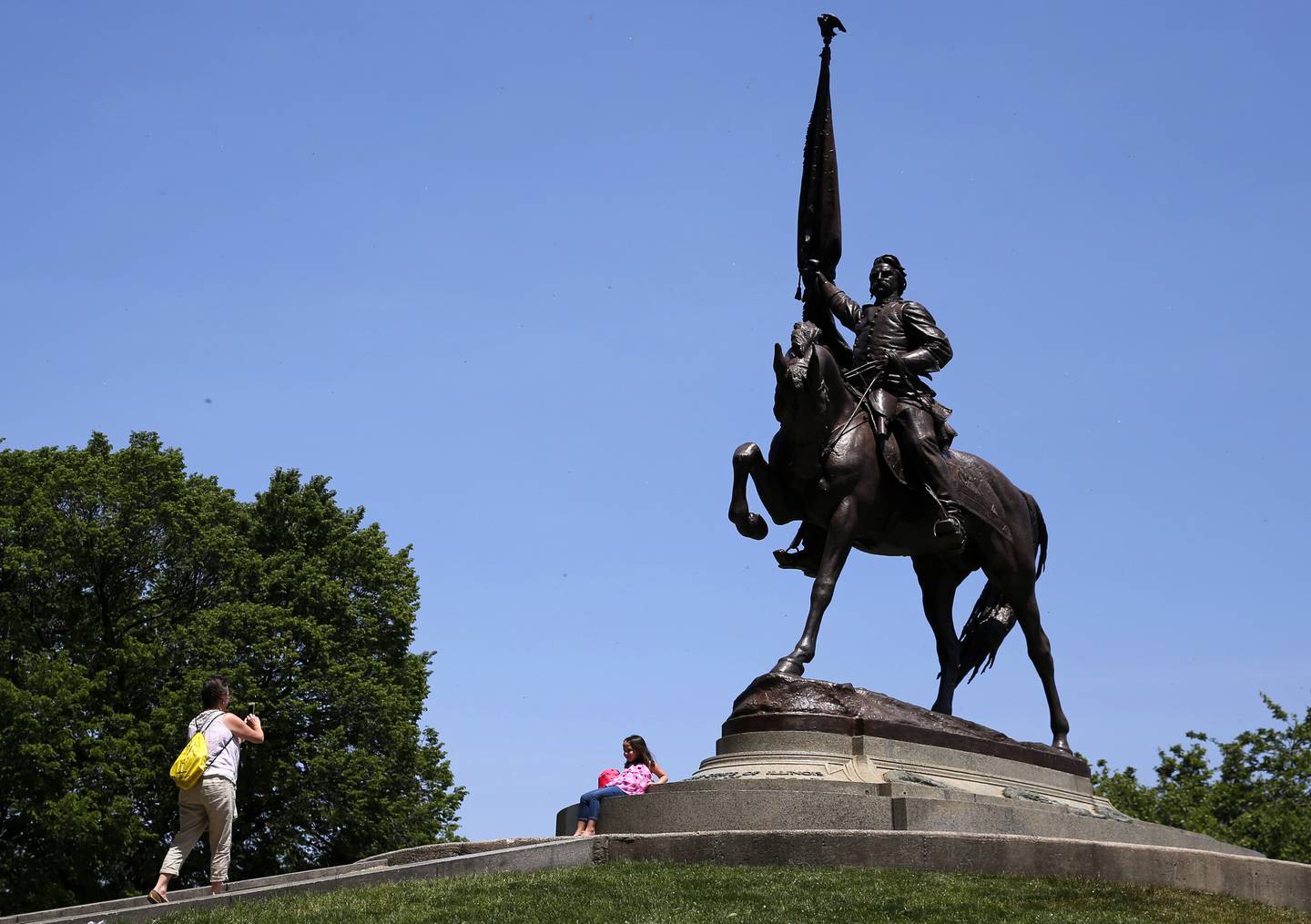 Park visitors in 2016 take pictures by the statue of Union Army Maj. Gen. John A. Logan in Grant Park in Chicago. Logan, known as the "Father of Memorial Day," ordered in 1868 that: "The 30th day of May is designated for the purpose of strewing with flowers or otherwise decorating the graves of comrades who died in defense of their country..." to honor the nearly 500,000 lives lost in the U.S. Civil War. First known as Decoration Day, Memorial Day expanded to an observance honoring all U.S. war dead after World War I and in 1971 was made an official national holiday to be held on the last Monday in May.