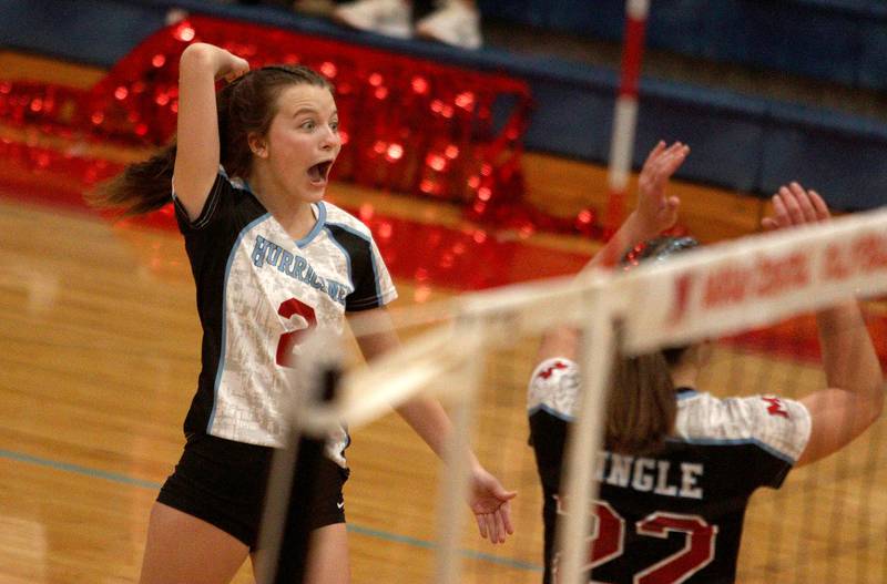 Marian Central’s Jillian Winkelman gets revved up after a point against Grayslake North in girls volleyball in Woodstock Monday.