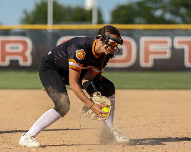 Wheaton-Warrenville South's Maddie Pool (17) scoops up a bunt during Class 4A Plainfield North Sectional semifinal softball game between Wheaton-Warrenville South at Oswego. May 29th, 2024.